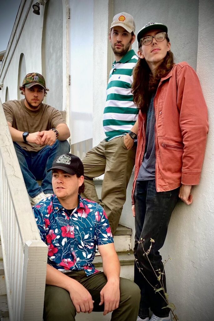 a group of people sitting on the steps of a building