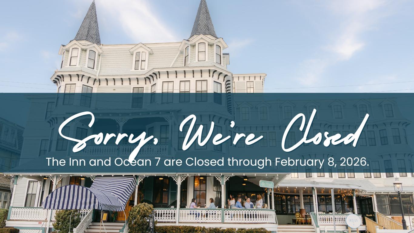 a large white building with a blue sign that says sorry we're closed