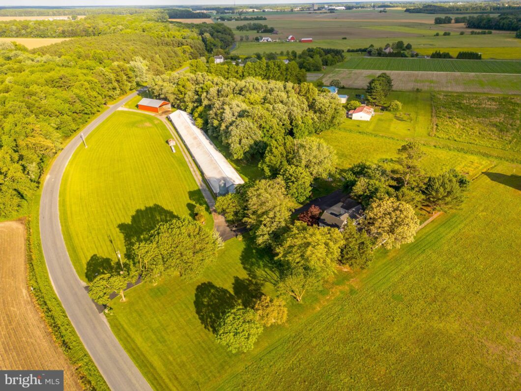 an aerial view of a farm in the country