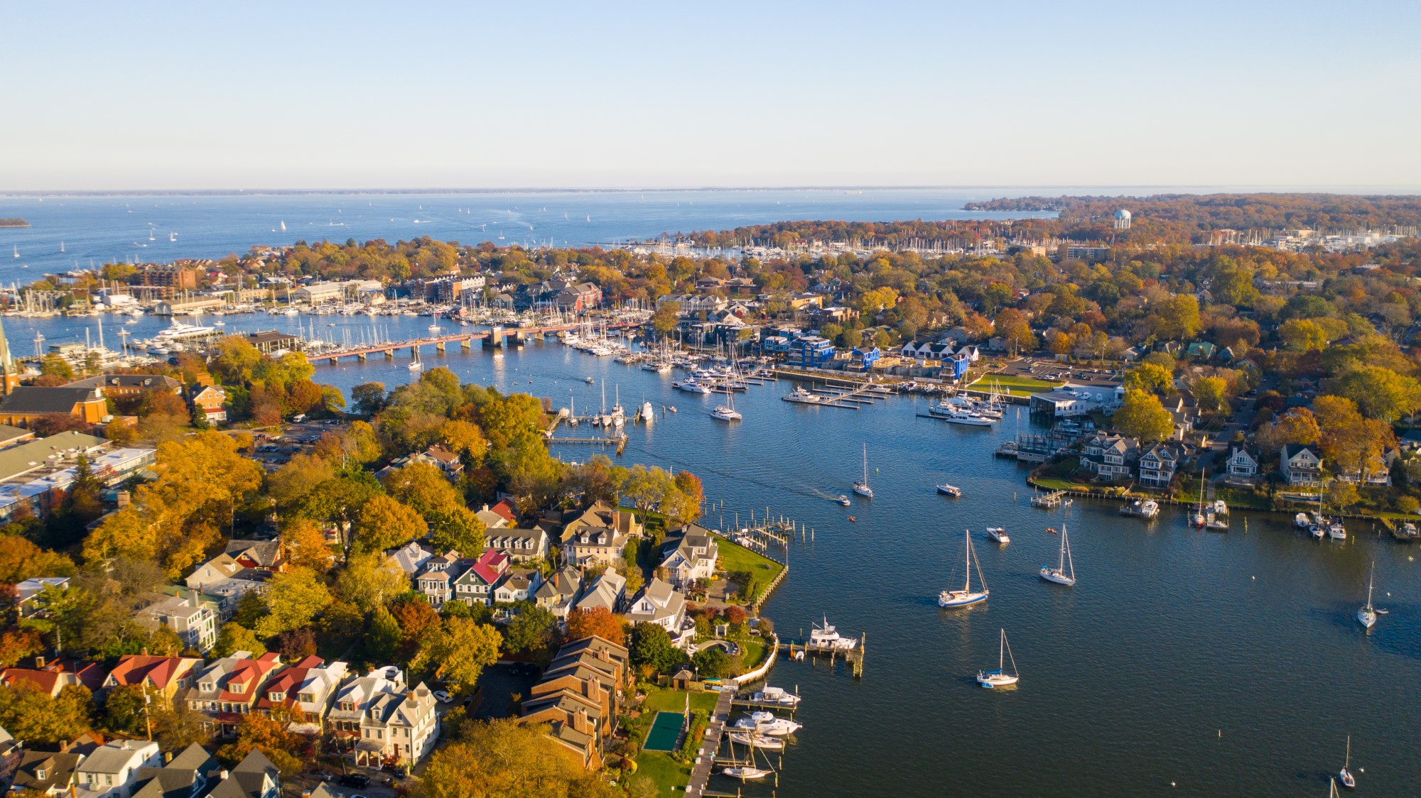 an aerial view of a harbor with boats in the water