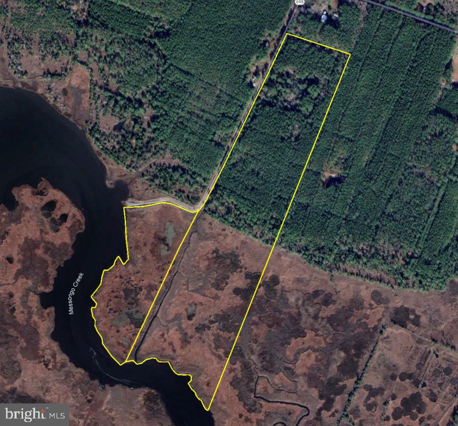 an aerial view of a lake and land