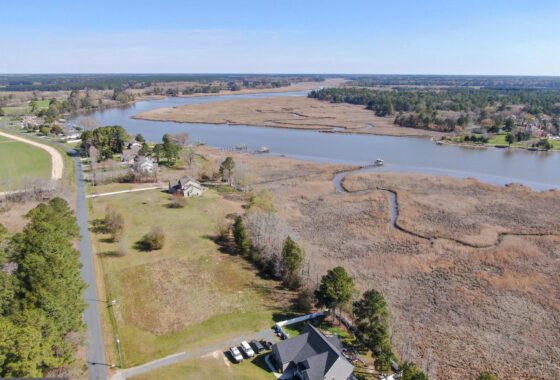 a bird's eye view of a house and a river