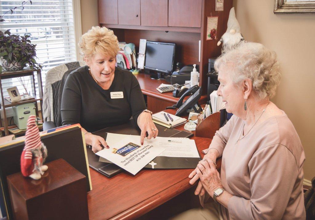 potential resident meeting wih coordinator in office and going over documents