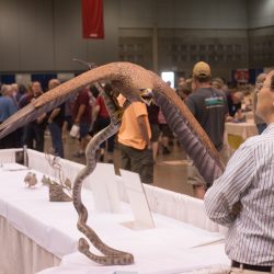 Sculpture of bird grabbing a snake