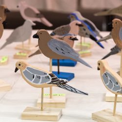 Small wooden painted birds on stands