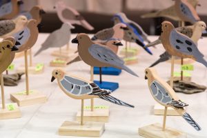 Small wooden painted birds on stands