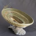 Woven green basket on rock