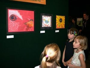 Kids standing in front of school art