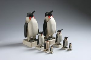 Collection of wooden carved penguin sculptures