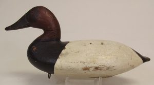 white and black wooden decoy