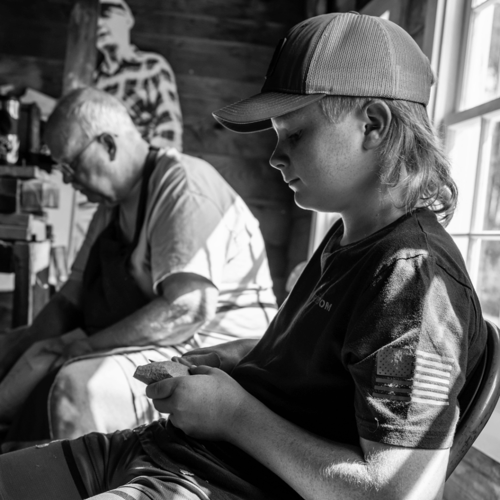 Rich Smoker and Jonny carving in the Ward Brothers Shop