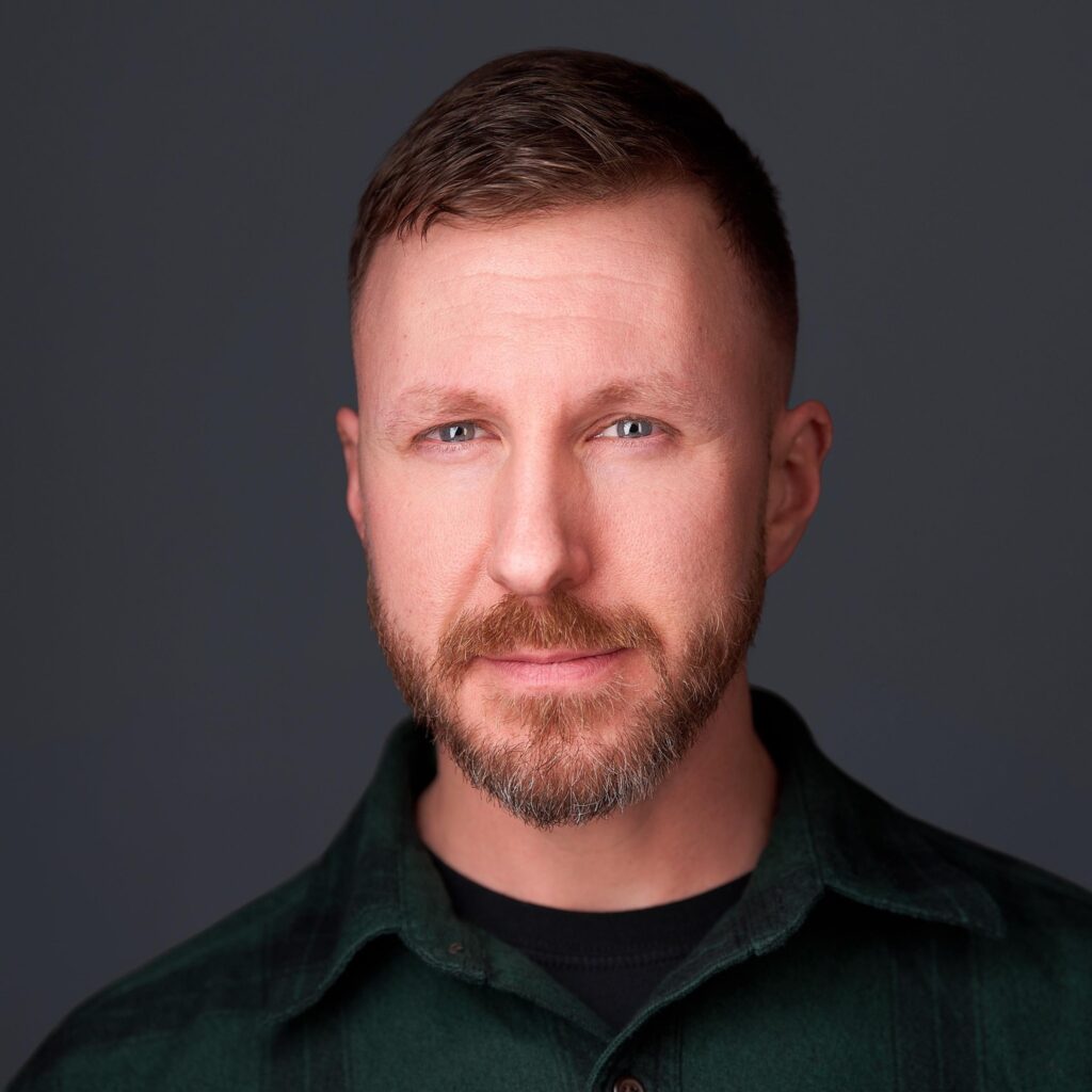 a man with a beard and green shirt