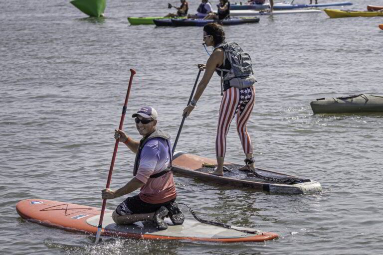 two people on paddle boards in the water