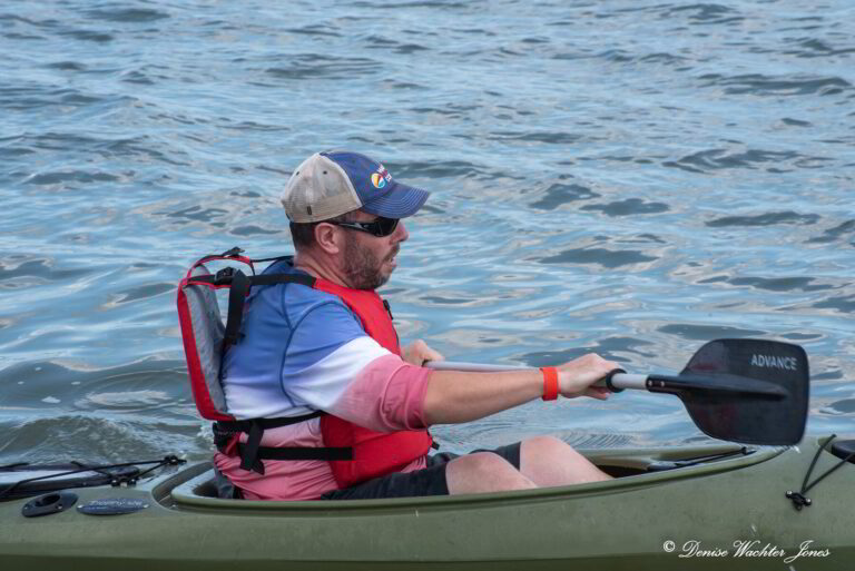 a man in a kayak on the water
