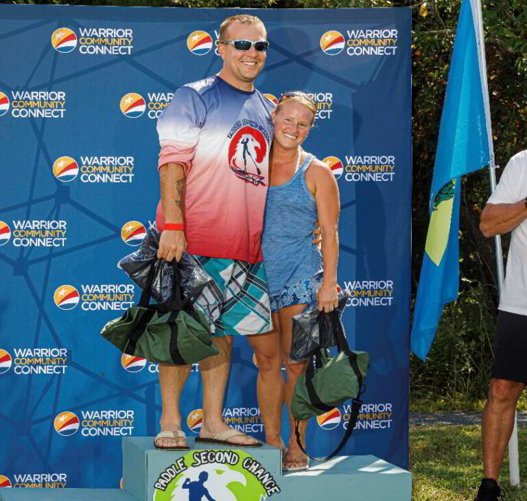 a man and woman standing on top of a podium