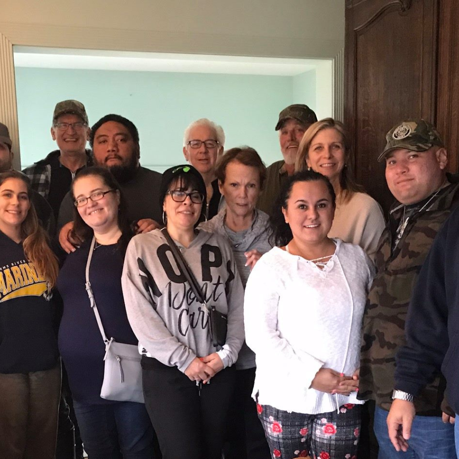 a group of people standing next to each other