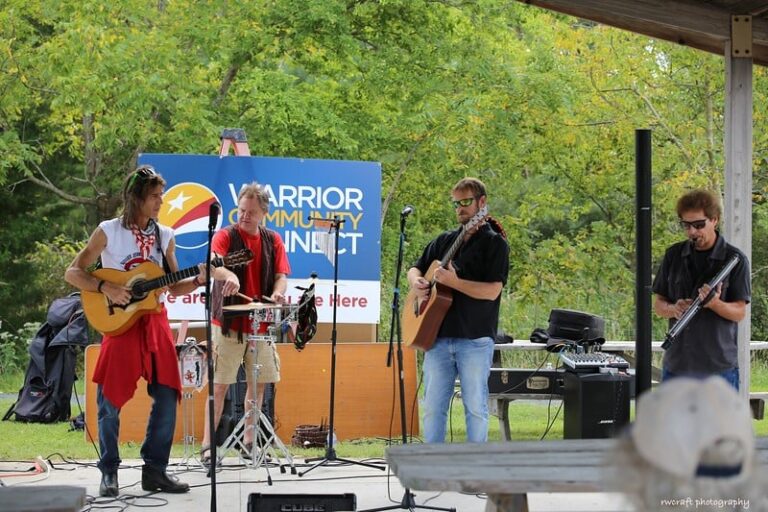 a group of people that are playing guitars