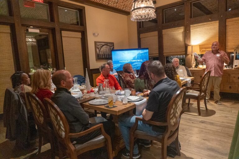 a group of people sitting around a table