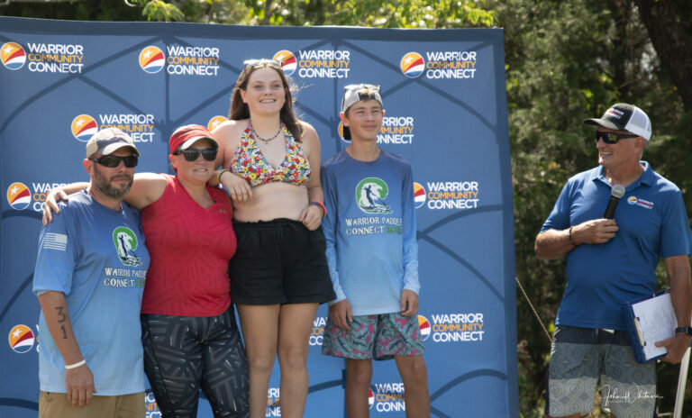 a group of people standing next to each other