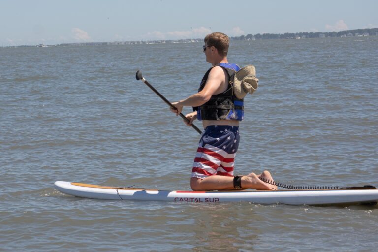 a man is paddling his kayak in the water