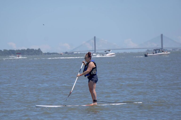 a woman on a surfboard in the water