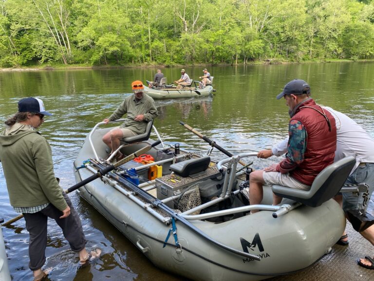 several people are in small boats on the water