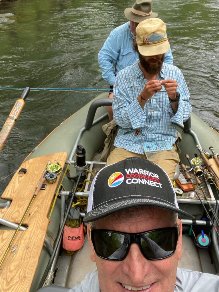 two people in a boat on the water