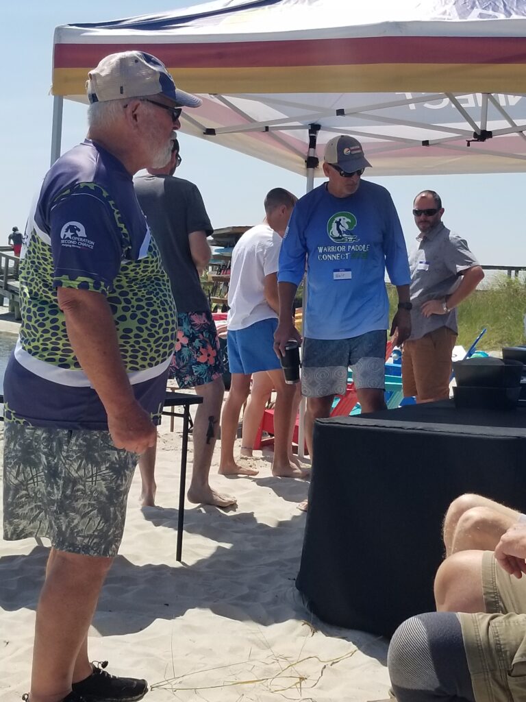 a group of people standing around a table