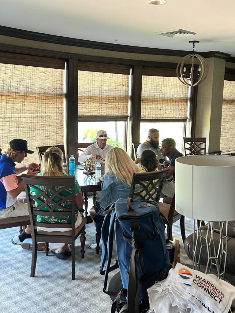 a group of people sitting around a table