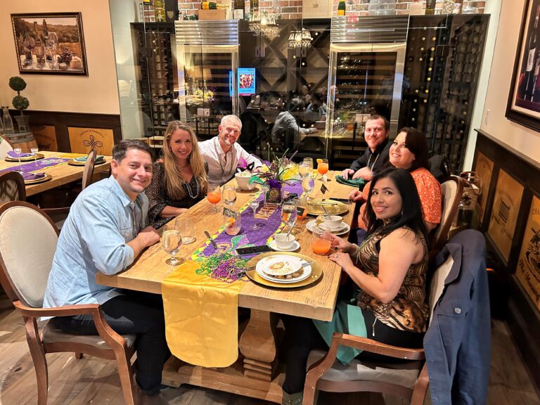 a group of people sitting around a table