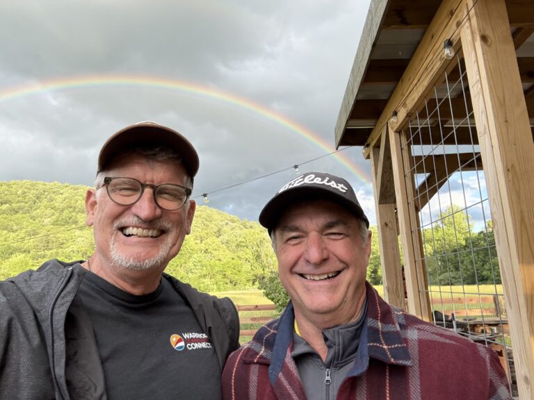 a couple of men standing next to each other