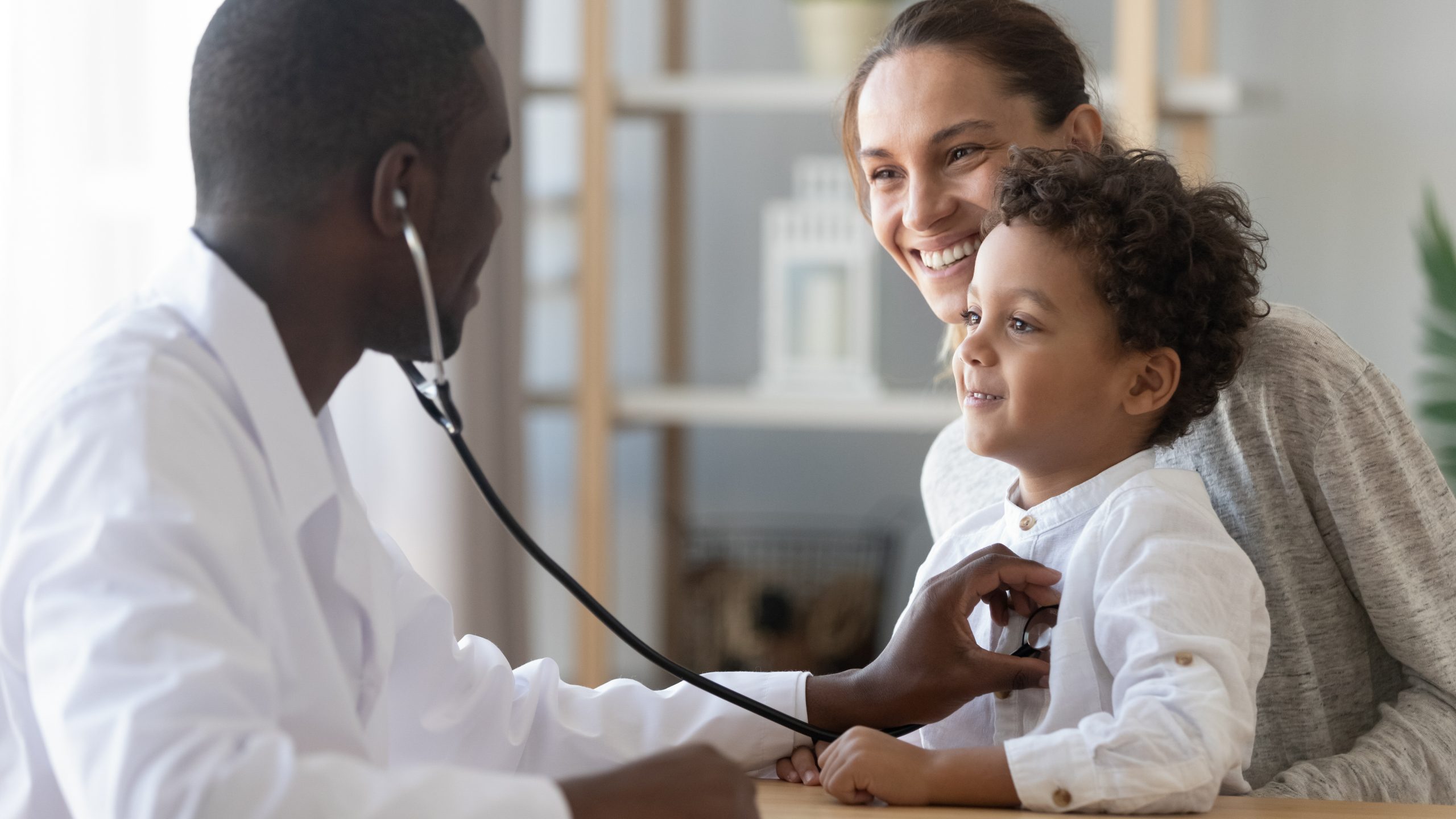 a young child being examined by a doctor
