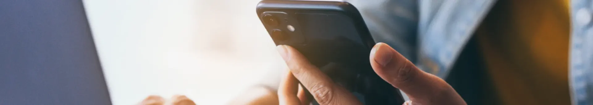 a close up of a person holding a cell phone