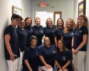 National Night Out staff posing together in office hallway
