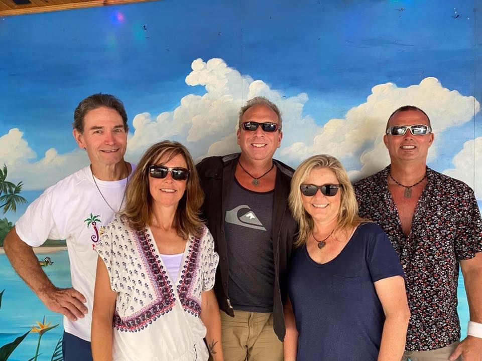 full circle band group photo by a mural