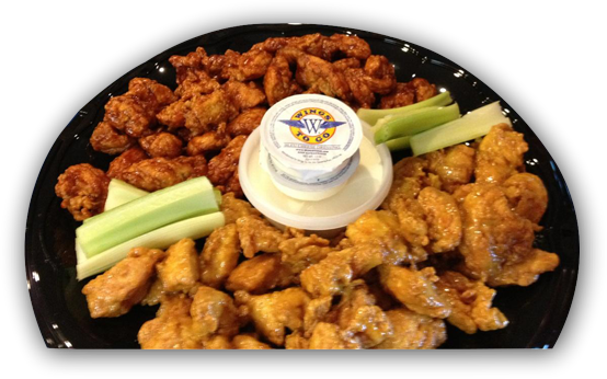 2 types of wings on a platter with dip and celery
