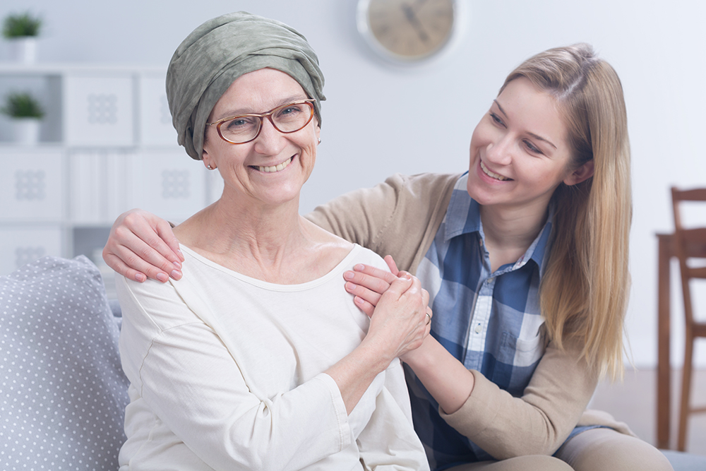Young mentor with cancer patient