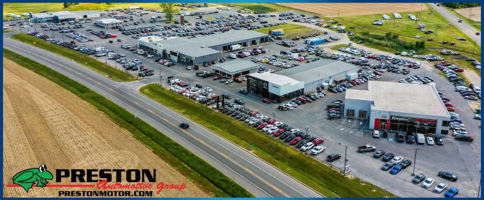 an aerial view of a parking lot with cars parked in it