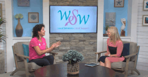 two women sitting in chairs talking to each other